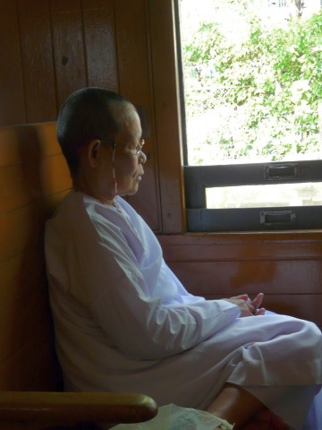 Buddhist nun on train